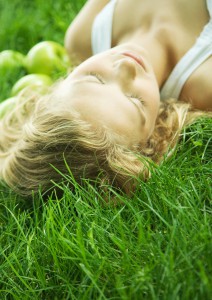 Woman lying in grass